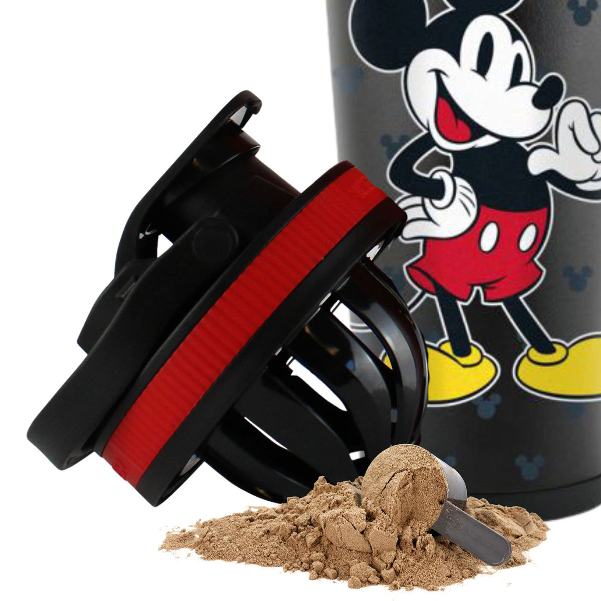 a picture of the Mickey Mouse Ice Shaker lid with the agitator twisted onto the bottom of the lid. In front of the lid is a pile of protein powder