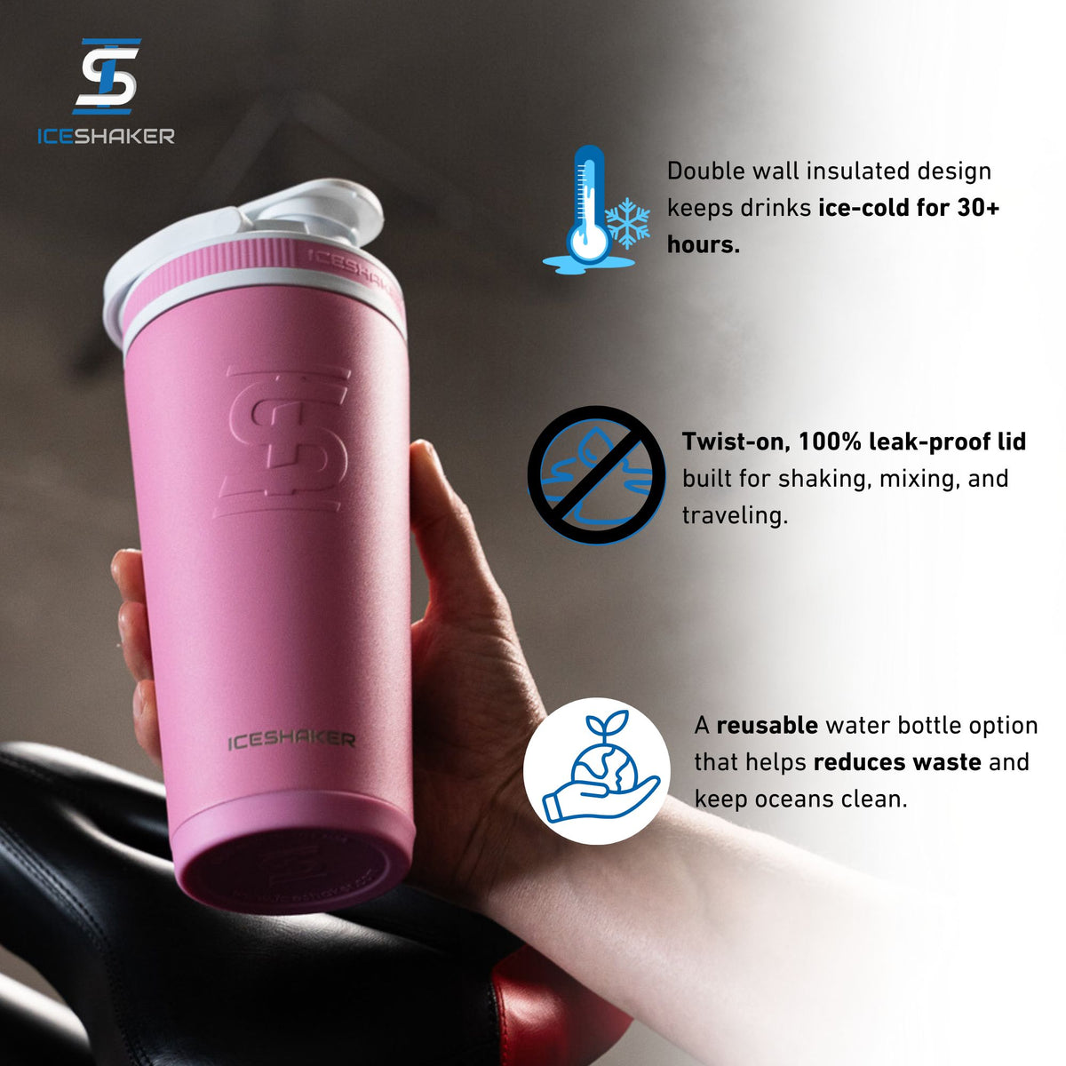 Person holding a Pink 26oz Ice Shaker with features listed out next to it. The features include the double-wall insulated design that keeps drinks ice-cold for 30+ hours, the twist-on leak-proof lid built for shaking, mixing, and traveling, and it being a eco-friendly, reusable water bottle option that helps reduce plastic pollution.
