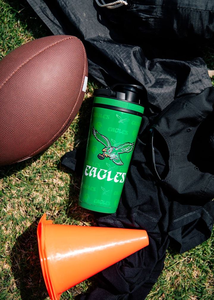 Vintage Philadelphia Eagles 4D Ice Shaker on the grass next to a football and cone