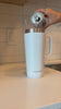 This video begins with a white-colored 26oz Flex Bottle with Handle being filled up with sparkling water followed by a young woman in athletic clothing walking onto her apartment balcony to overlook the city with the filled-up Flex Bottle with Handle in her hand. She then does a bit of yoga and takes a drink from the Flex Bottle with Handle.